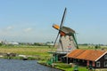 Traditional dutch windmill near the canal in summer day. Netherlands Royalty Free Stock Photo