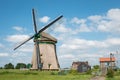 Traditional Dutch windmill with pumping house