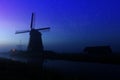 Traditional Dutch windmill in starry night. The Netherlands Royalty Free Stock Photo