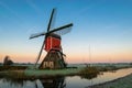 Traditional dutch windmill at sunrise on a cold morning in autumn