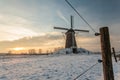 Traditional Dutch windmill in winter during sunset Royalty Free Stock Photo