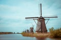 Traditional Dutch windmills on a canal bank in Nethelands