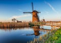 Traditional Dutch windmills from the channel Rotterdam. Holland. Royalty Free Stock Photo