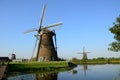 Traditional dutch windmills in the famous place of Kinderdijk, UNESCO world heritage site. Netherlands. Royalty Free Stock Photo