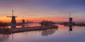 Traditional Dutch windmills at sunrise at the Kinderdijk Royalty Free Stock Photo