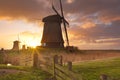 Traditional Dutch windmills at sunrise
