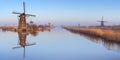 Traditional Dutch windmills at sunrise in winter at the Kinderdijk Royalty Free Stock Photo