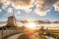 Traditional Dutch windmills against sunset in Zaanse Schans, Amsterdam area, Holland