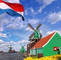 Traditional Dutch windmills with tulips in Zaanse Schans, Amsterdam area, Holland Royalty Free Stock Photo