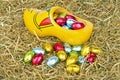 Traditional dutch wooden clog with little colored easter eggs