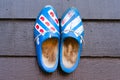 Traditional dutch wooden shoes hanging at a wall