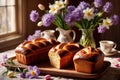 Traditional easter bread on table with flowers, traditional springtime festive holiday celebration decoration