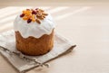 Traditional Easter Cake with Icing and Dried Fruits on Light Table Royalty Free Stock Photo