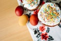 Traditional easter cake kulich Ukrainian style with colored eggs on painted towel Royalty Free Stock Photo