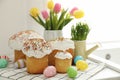Traditional Easter cakes and dyed eggs on kitchen counter Royalty Free Stock Photo