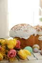 Traditional Easter cakes, flowers and dyed eggs on table, closeup Royalty Free Stock Photo