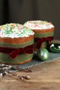 Traditional Easter cakes, painted eggs and willows on wooden table