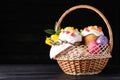 Traditional Easter cakes in wicker basket on dark background. Space for text Royalty Free Stock Photo