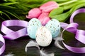 Traditional easter egg decoration with tulips and ribbo Royalty Free Stock Photo