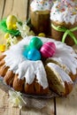 Traditional Easter food cake: the dough wrapped in a roll with nut filling and raisins, with sweet icing. Festive Easter table Royalty Free Stock Photo