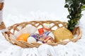 Traditional Easter wicker basket with white frill Royalty Free Stock Photo