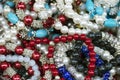 Traditional eastern bright colorful costume jewellery on a street market table. Good for background. selective focus Royalty Free Stock Photo