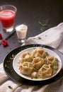 traditional Eastern dish manti or manty with beef in a dark Royalty Free Stock Photo