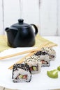 Traditional eastern dish with salmon, shrimp - sushi rolls on a white plate. Royalty Free Stock Photo