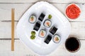 Traditional eastern dish with salmon sushi rolls on a white plate. Royalty Free Stock Photo