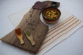 Traditional eastern european food setup. Walnut cutting board, bean soup,  sausage and spices. Bulgaria, balkan food Royalty Free Stock Photo