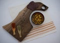 Traditional eastern european food setup. Walnut cutting board, bean soup,  sausage and spices. Bulgaria, balkan food Royalty Free Stock Photo