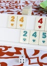 Traditional Eastern Turkish game okey with white knuckles and multicolored numbers Royalty Free Stock Photo