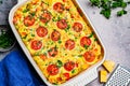 Traditional egg frittata with tomatoes and cheese in oven dish, Top View. Baked omelet with vegetables and cheese Royalty Free Stock Photo