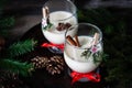 Traditional eggnog Christmas cocktail in a glass goblet decorated with New Year clothespin. Non-alcoholic option Royalty Free Stock Photo