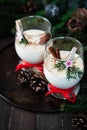 Traditional eggnog Christmas cocktail in a glass goblet decorated with New Year clothespin. Non-alcoholic option Royalty Free Stock Photo