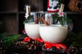 Traditional eggnog Christmas cocktail in a glass goblet decorated with New Year clothespin. Non-alcoholic option Royalty Free Stock Photo
