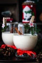 Traditional eggnog Christmas cocktail in a glass goblet decorated with New Year clothespin. Non-alcoholic option Royalty Free Stock Photo