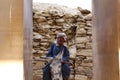 Traditional Egyptian attired man on a Donkey