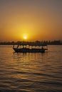 Traditional egyptian felluca sailing boat sailing on Nile at sunset Royalty Free Stock Photo