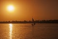 Traditional egyptian felluca sailing boats sailing on Nile at sunset Royalty Free Stock Photo