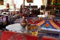 Traditional Egyptian interior of a tent with patterned and colorful blankets and decoration