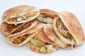 Traditional Egyptian popular breakfast street sandwiches of mashed fava beans, fried crispy falafel balls, fried Alexandrian