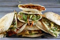 Traditional Egyptian popular breakfast street sandwiches of mashed fava beans, fried crispy falafel balls, fried potatoes,