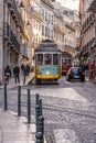 Traditional electric streetcar on a street in Lisbon