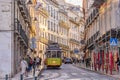 Traditional electric streetcar on a street in Lisbon