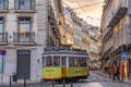 Traditional electric streetcar on a street in Lisbon