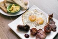Traditional english british fried breakfast with eggs bacon and