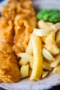 Traditional english food - Fish and chips with mushy peas Royalty Free Stock Photo