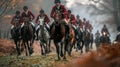 Traditional english Fox hunters are galloping on field in red hunting suits, hunting dogs running next to horses.