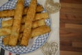 Close up food photography of traditional English homemade cheese straws on a plate with love heart decorations